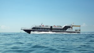 BlueWater Express speedboat cruising through calm waters toward Gili Trawangan.